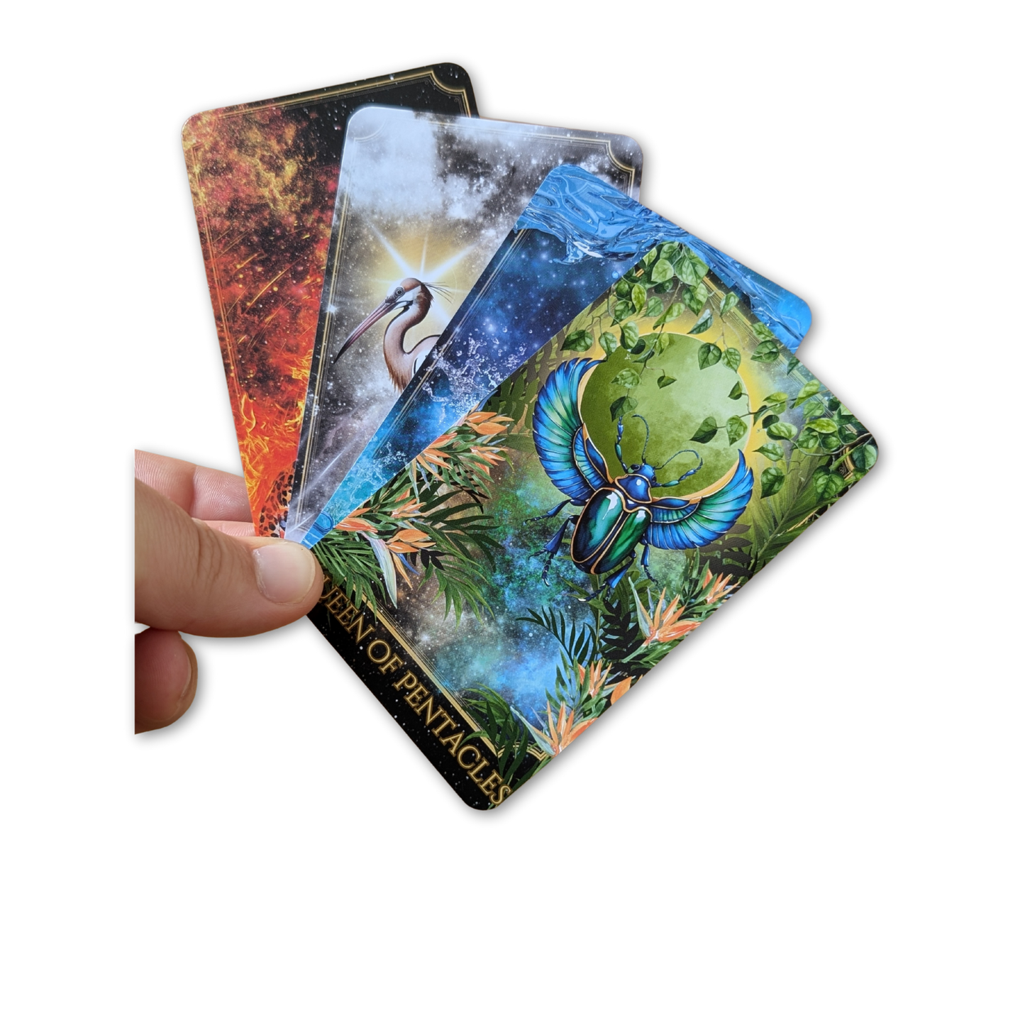 Four Queens laid flat Written in the Stars Tarot Deck by Emporos — Queen of Pentacles, Cups, Swords and Wands featuring Egyptian animal symbolism