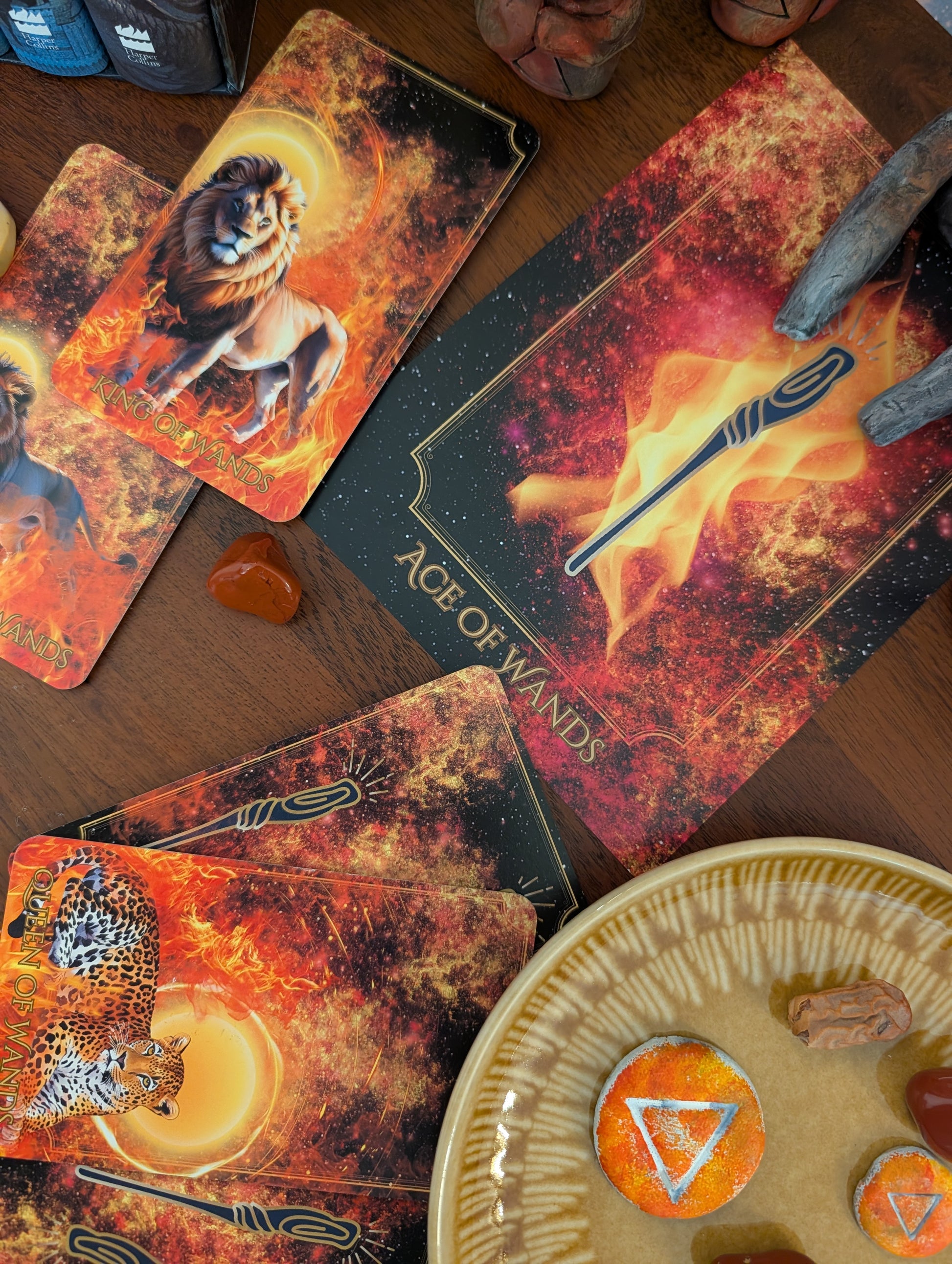 Written in the Stars Tarot cards by Emporos — Ace, King and Queen of Wands Fire element spread on a wooden altar with crystals, used for Sekhem healing and spiritual practice
